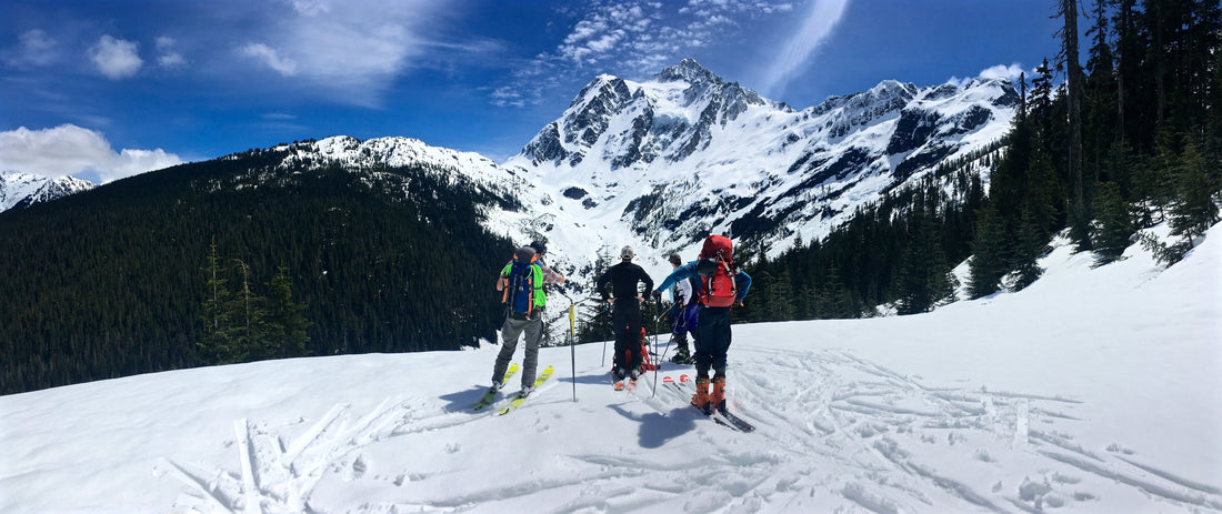 Skiers look at Mount Shuksans Hanging Glacier and White Salmon Glaciers