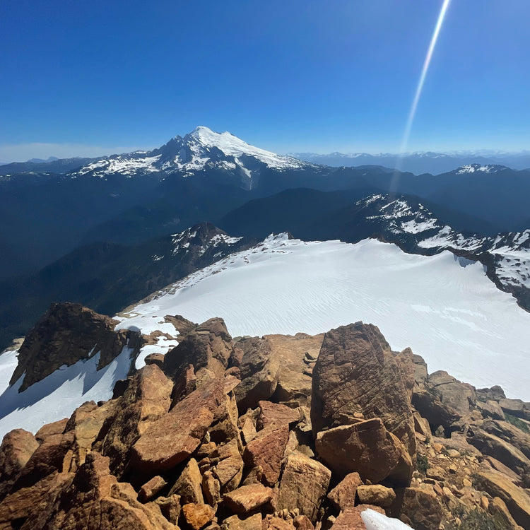 mt baker in the distance looking over the sisters glacier from s twin sisters ne ridge