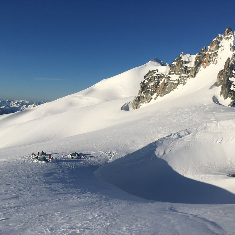 a very scenic camp on the inspiration glacier with eldorado peak in the background and glacier peak in the distance