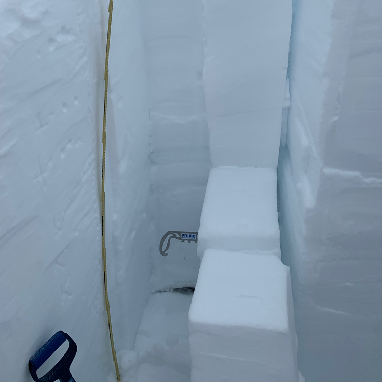 Looking at columns of snow in a snow study pit during an AIARE 2 course. There's so much snow!