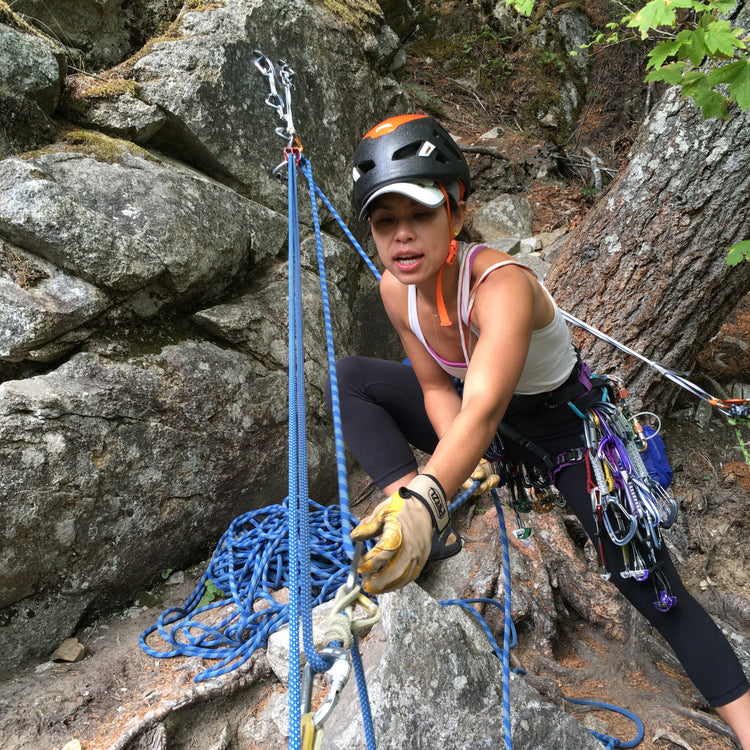 a lady climber performs a 3:1 mechanical advantage system while hauling a rock climber during a rock rescue 2 day course at Index Washington