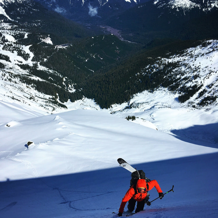 A skier working their way up the steeper section of the boot pack.
