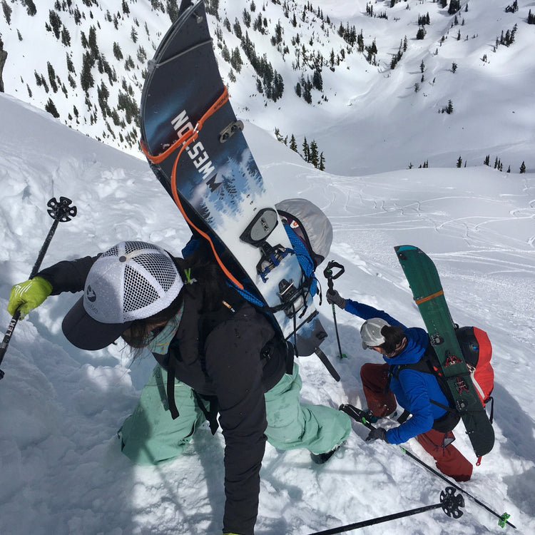 During the advanced splitboard course participants boot pack up steep terrain to access even steeper runs.