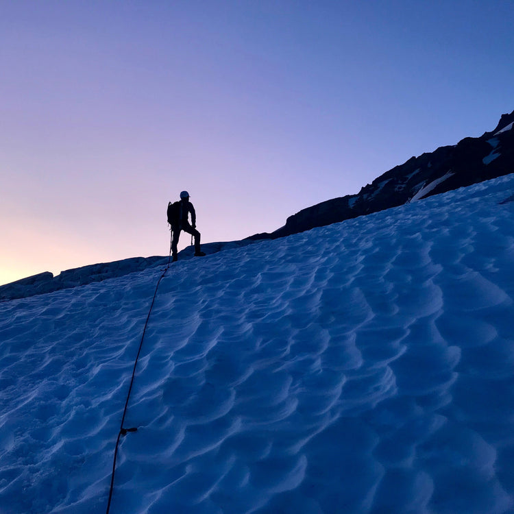 Silhouette of a climber against an incredible sunrise.