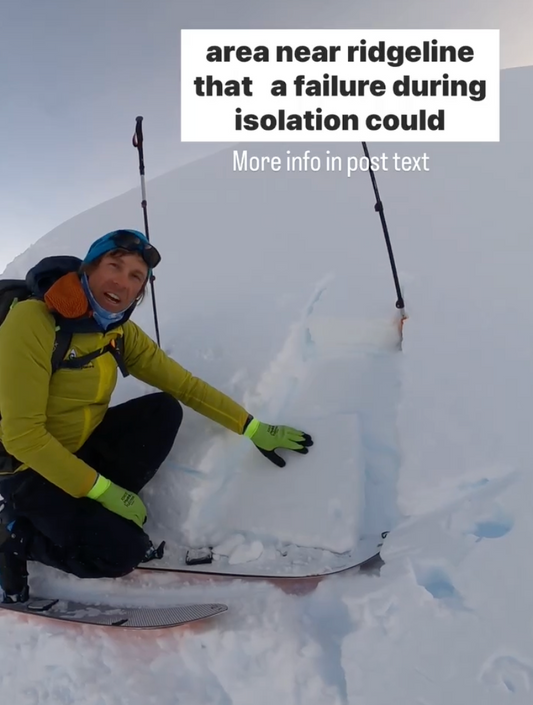 a progessional ski guide shows layers in a windslab hand pit 