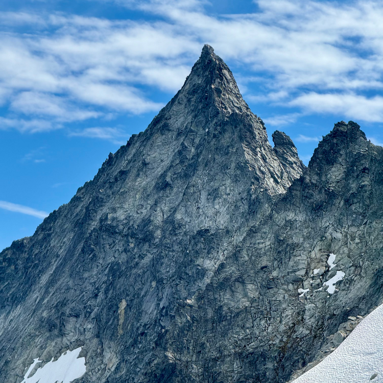 Tall, rugged mountain peak with a clear blue sky