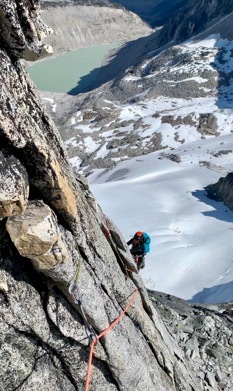 a girl follows a climbing guide in the bugaboos