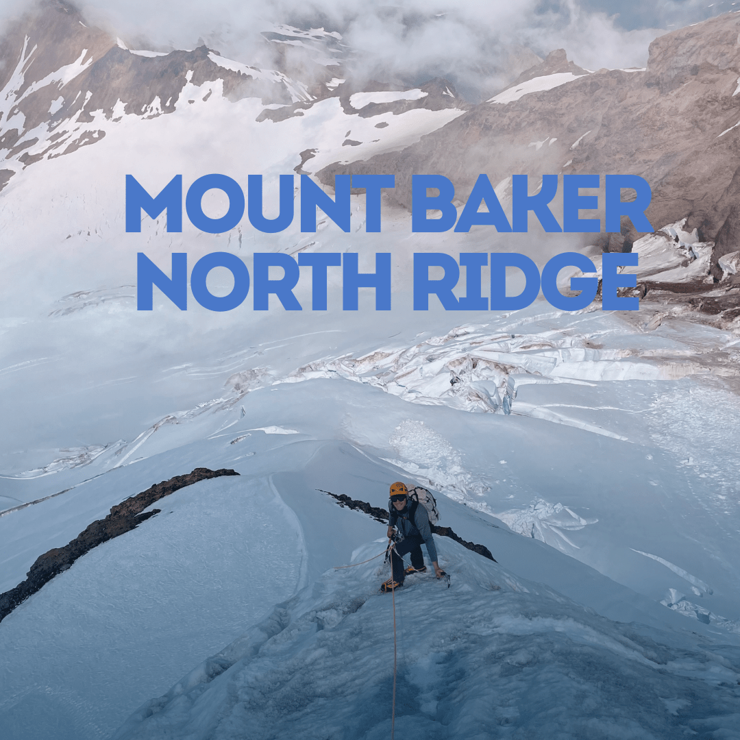 Person on a snowy mountain ridge with Mount Baker North Ridge