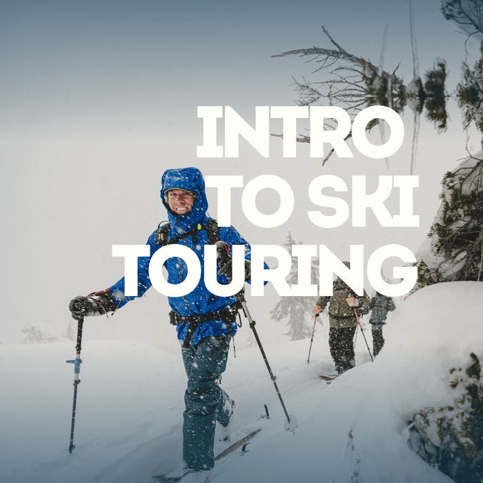 Person skiing with intro to Ski Touring in a snowy landscape.