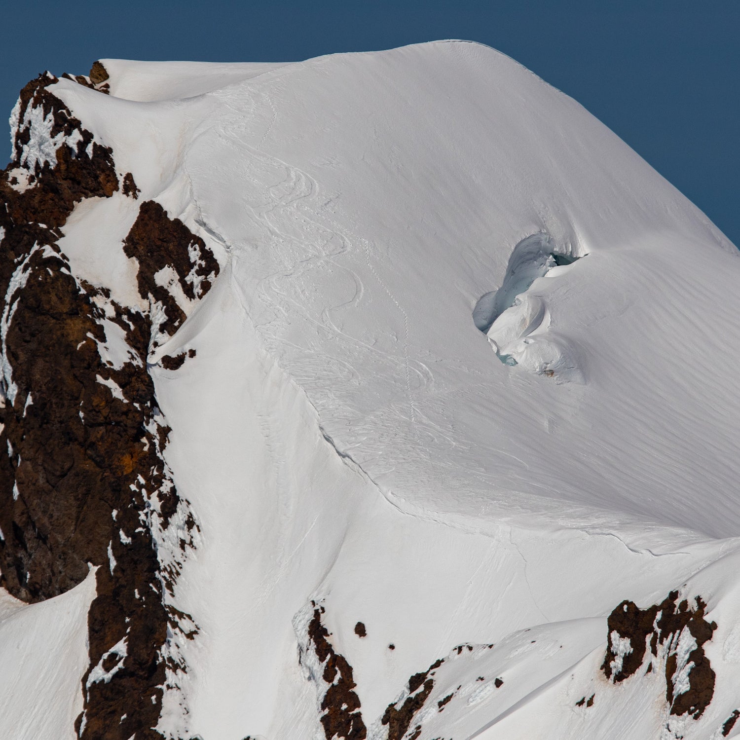 Ski Tracks coming down colfax peak summit and into the south couloir one of the sattelite peaks of mount baker above the deming glacier