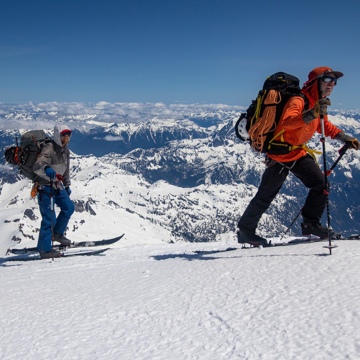 2 splitboarders skin above mount shuksan, mount baker ski area, on the kulshan summit