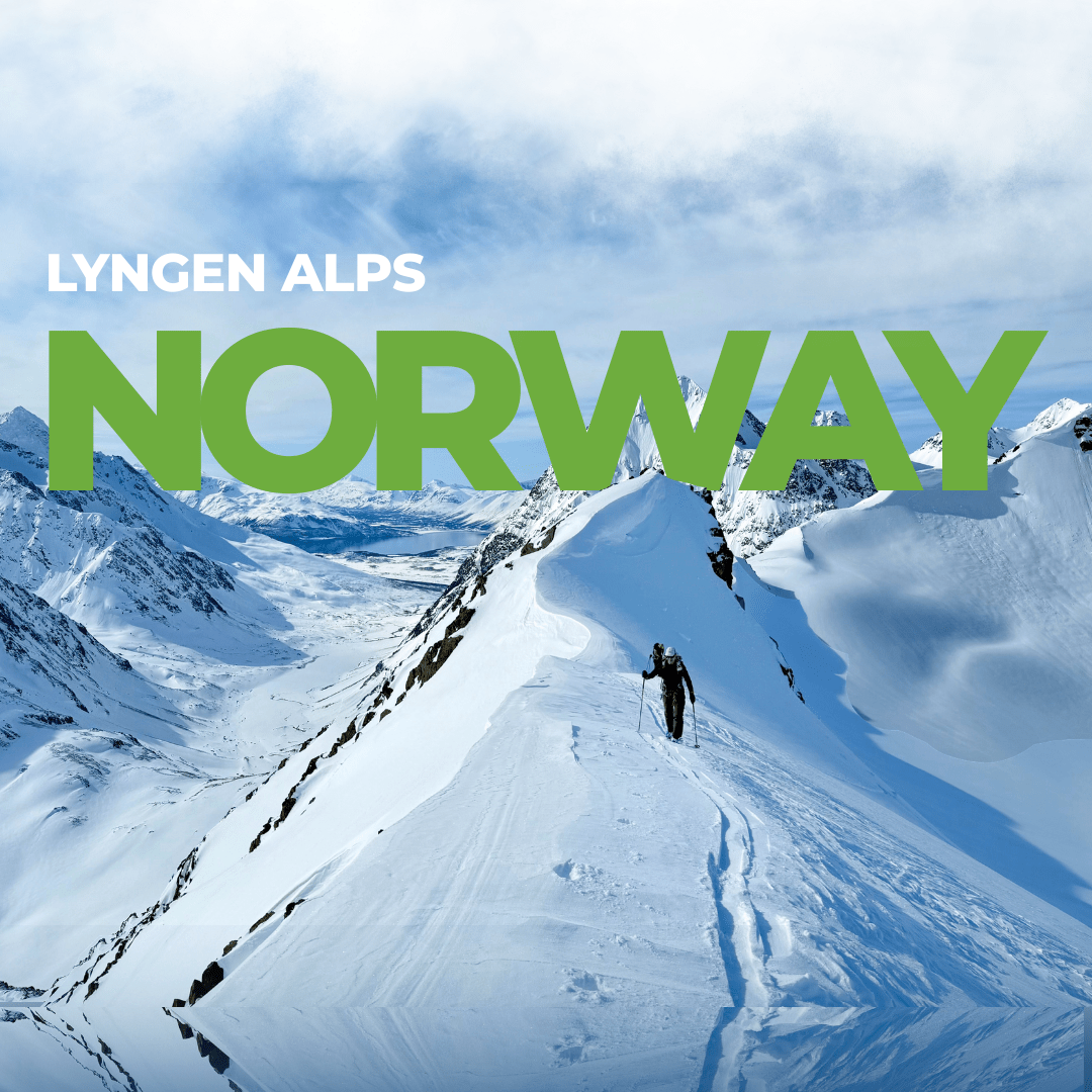 Guided Lyngen Alps ski trip — a ski tourer skins a ridge above the fjords of Arctic Norway