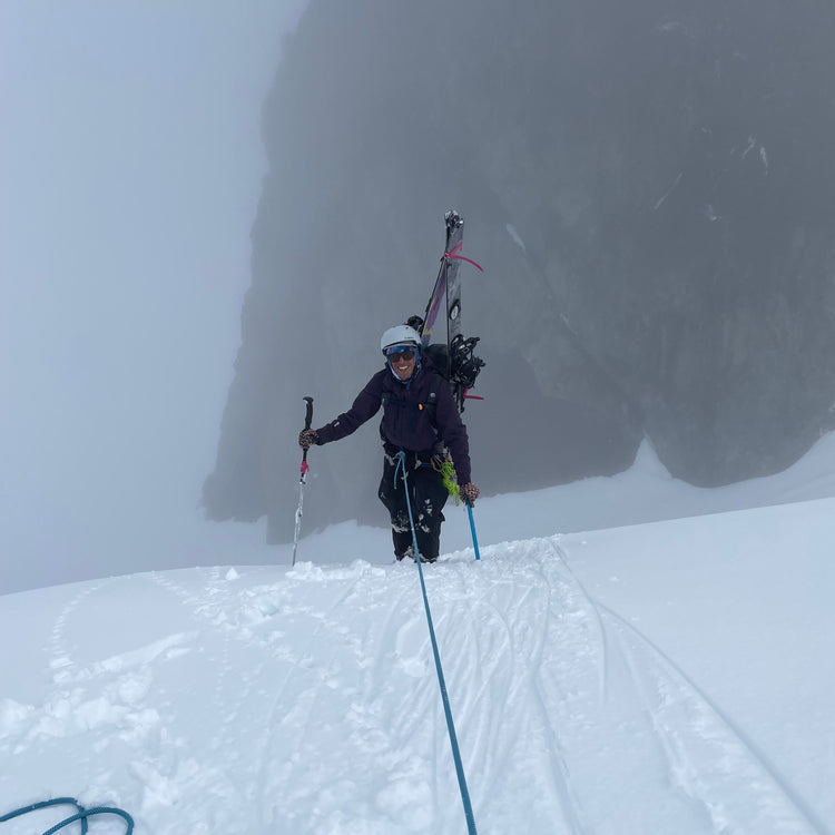 steep snow belay for a splitboard mountaineer on hells high way upper curtis glacier, sulphide glacier, mount shuksan white salmon glacier with the splitboard on their back
