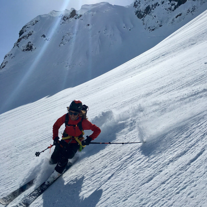 Backcountry skier skinning uphill during a splitboard and ski touring course near Mount Baker