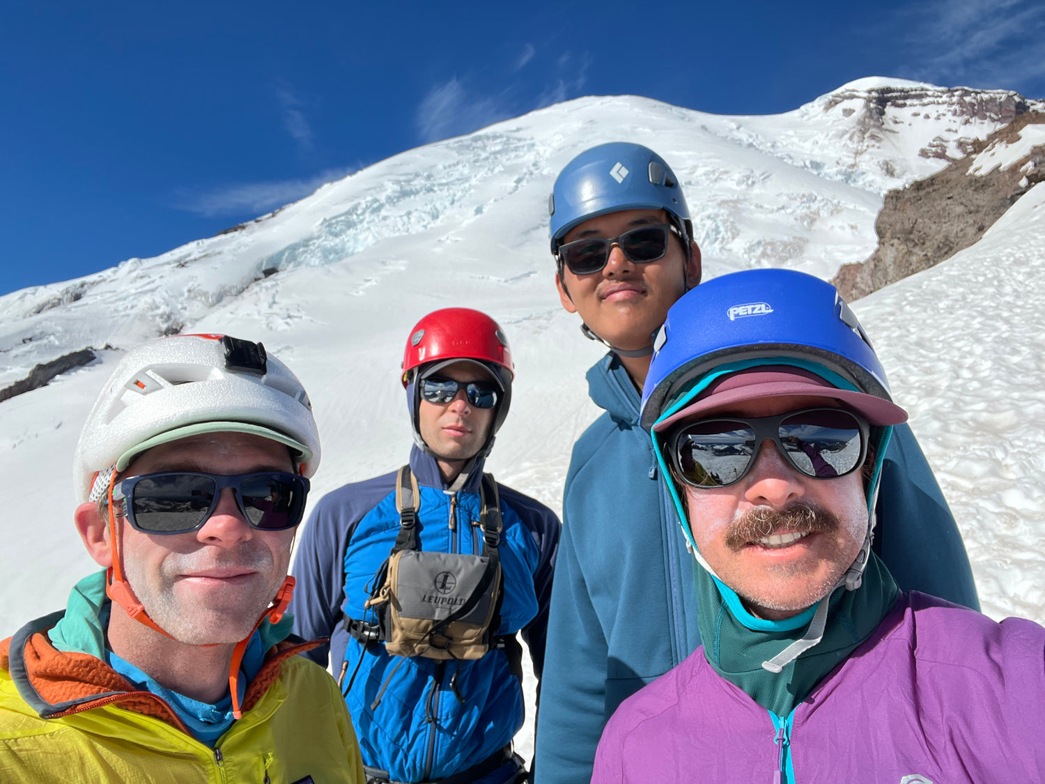 smirks and slugs on the faces of the 2022 climbing team