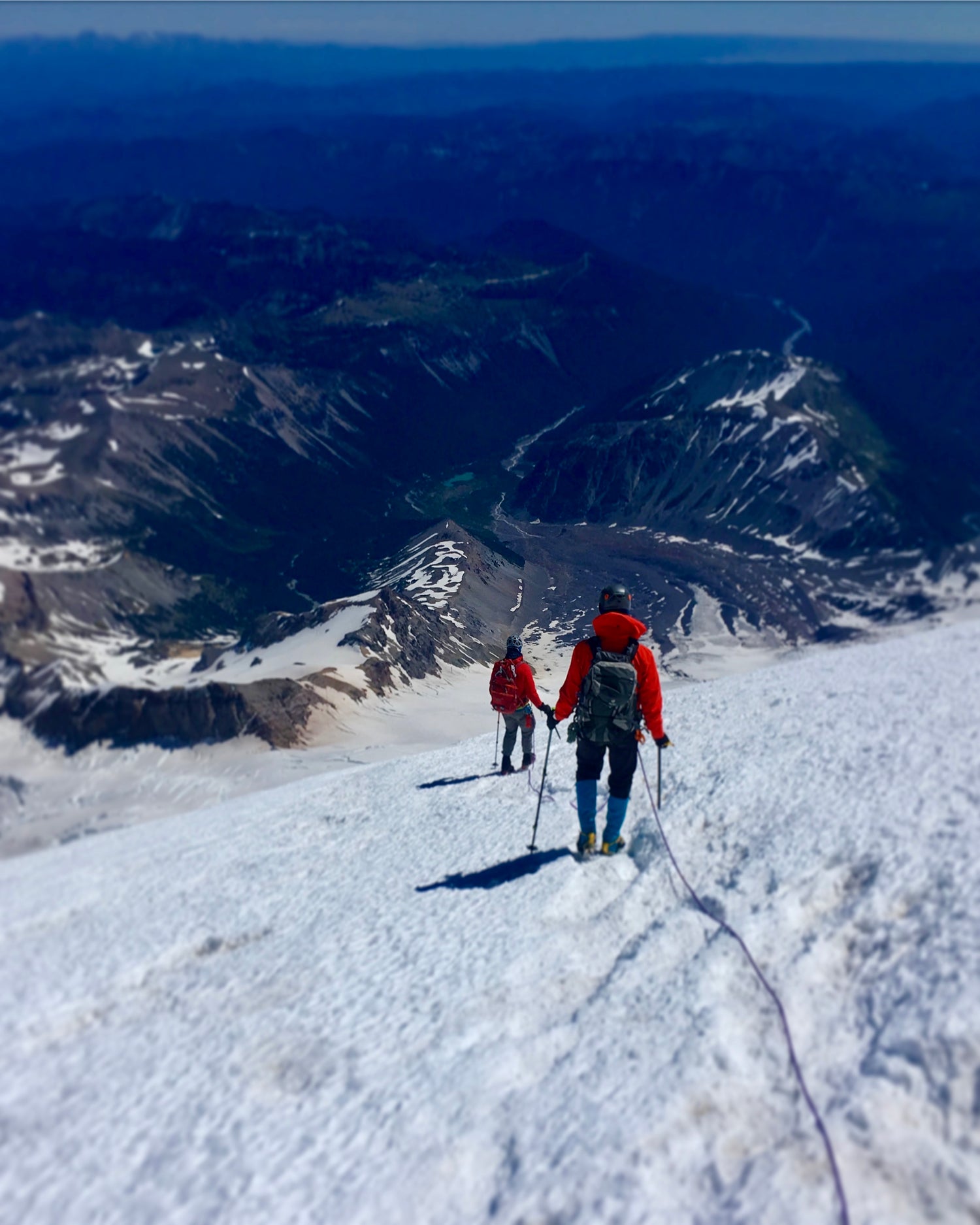 climbers descending glacier ice and snow on mount rainier national park