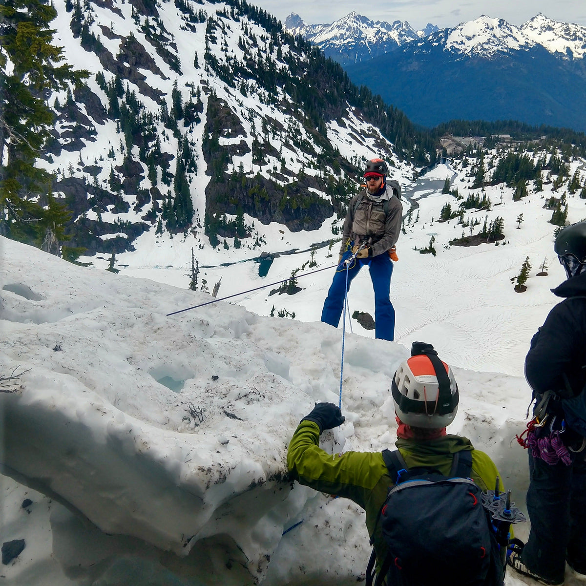 Participants learn how to rappels on a snow Ballard during a splitboard mountaineering course at Mount Baker. 