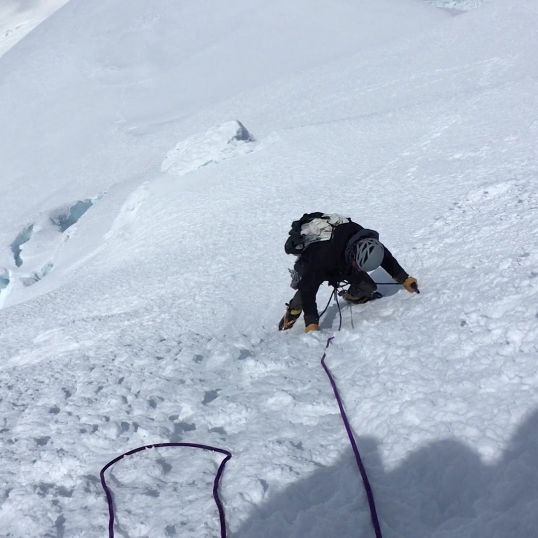 a skier climbs steep ice pitches during the summer on mount bakers north ridge
