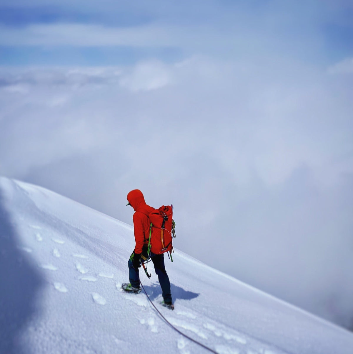 high above the clouds near the summit bergschrund on the north ridge of mount baker