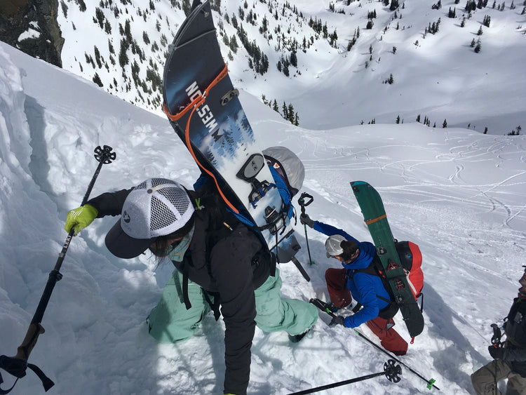 During the advanced splitboard course participants boot pack up steep terrain to access even steeper runs. 