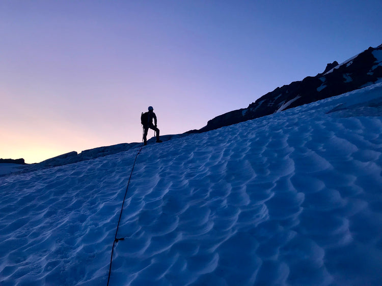 Silhouette of a climber against an incredible sunrise.