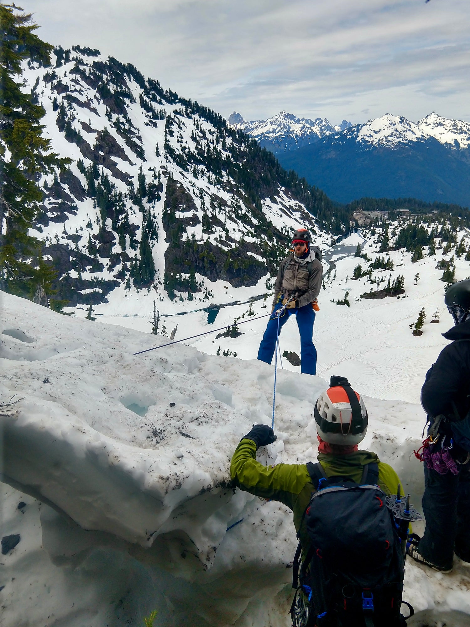 Participants learn how to rappels on a snow Ballard during a splitboard mountaineering course at Mount Baker. 