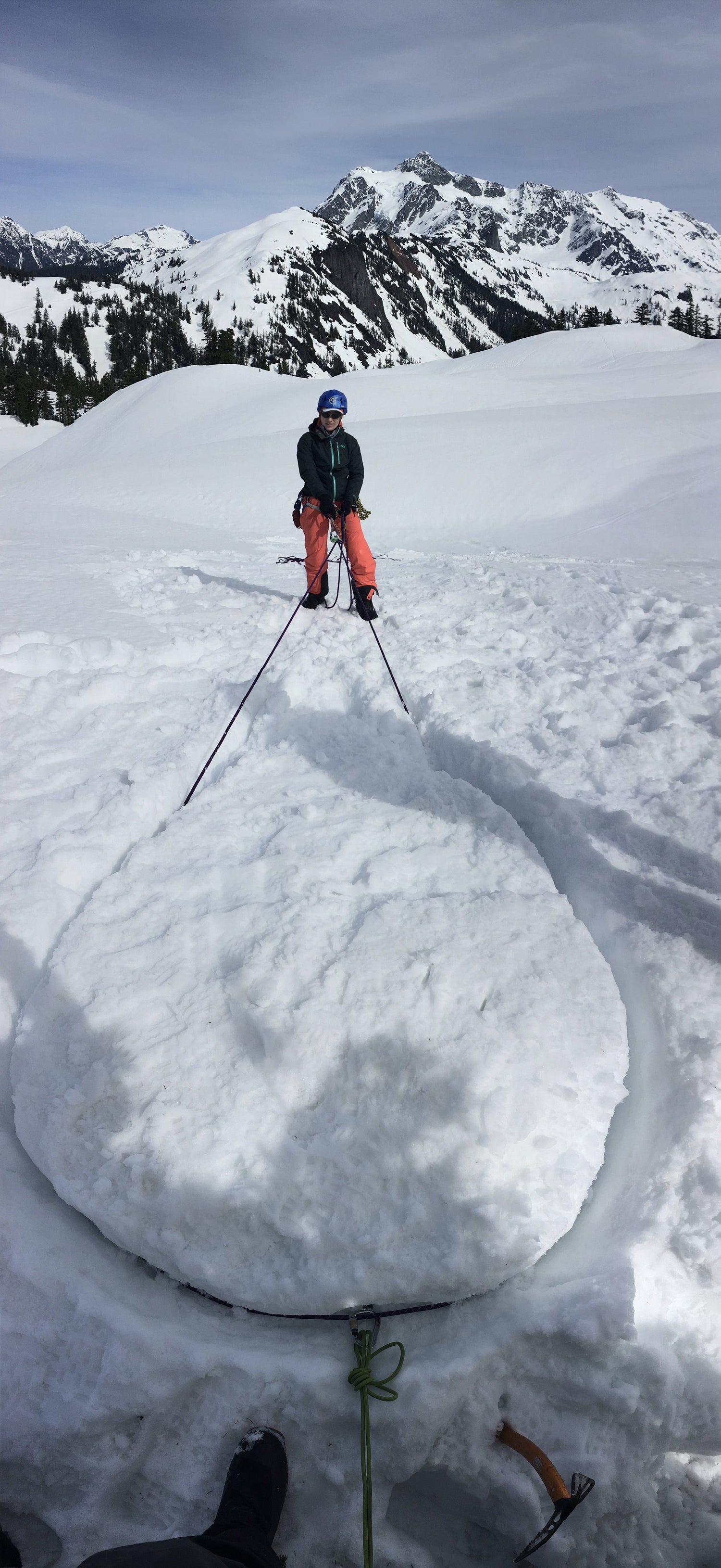 a woman hangs on a rope around snow boallard while testing and learning during the only womens splitboarding program in the north cascades washington seattle