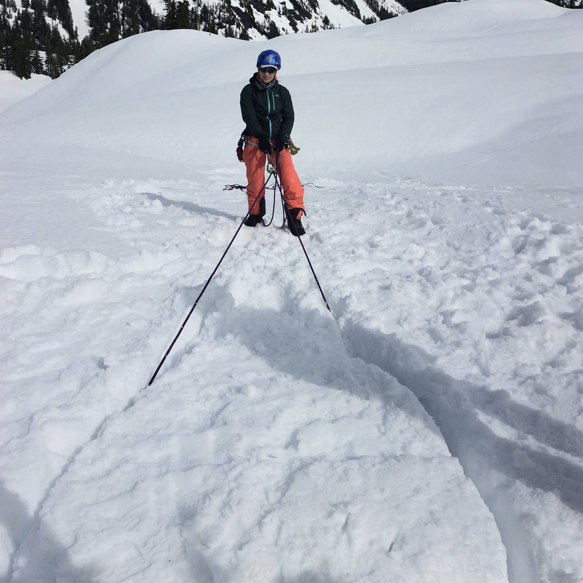 Practicing different kinds of snow anchors with Mount Shuksan in the background. 
