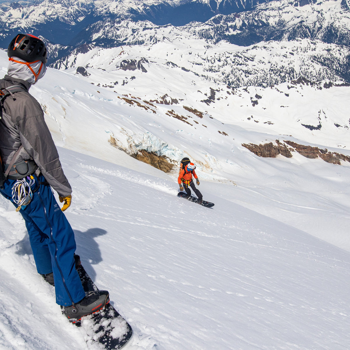 Splitboarders descend the NE Face of Sherman Peak during an advanced split boarding mountaineering course
