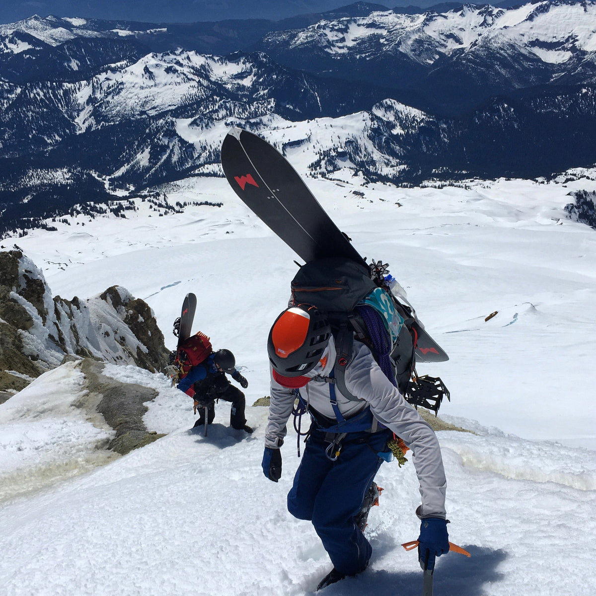 Splitboarders on Sherman Peak on Mount Baker during a guided backcountry descent on kulshan via the squak glacier