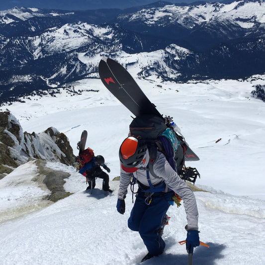 Splitboarders are guided up Sherman Peak on Mount Baker during a guided ski descent. Guided Exposure provides backcountry ski and splitboard guiding. on mount shuksan and kulshan via the squak glacier